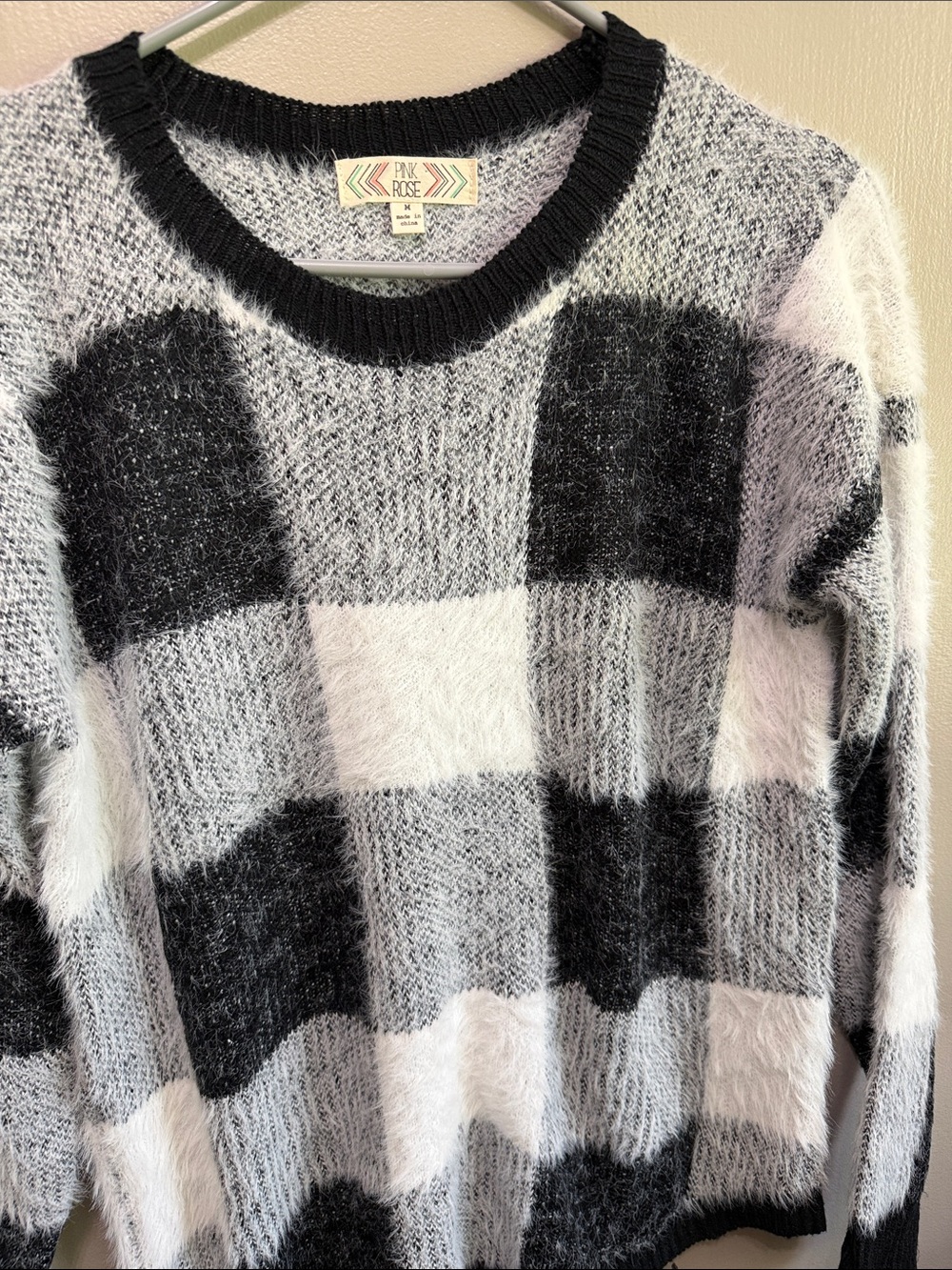 Women’s black and white fuzzy (soft) crewneck.